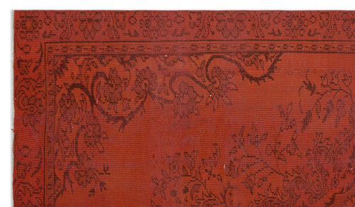 Load image 1 in gallery view. Terracotta red rug with a dark brown floral border and intricate vine-like patterns.