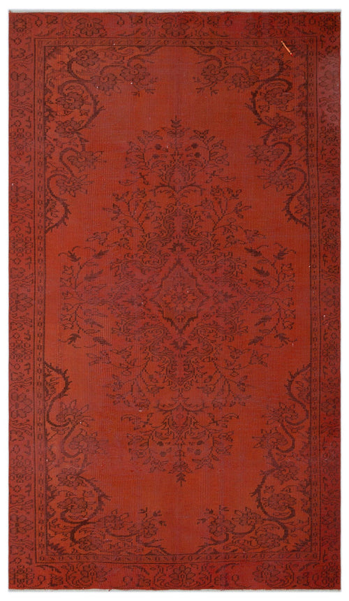 Load image 1 in gallery view. Terracotta red rug with a dark brown traditional floral medallion pattern and a decorative border.