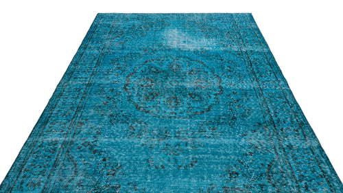 Load image 1 in gallery view. Distressed turquoise rug with a dark grey central medallion and traditional border pattern on a white background.