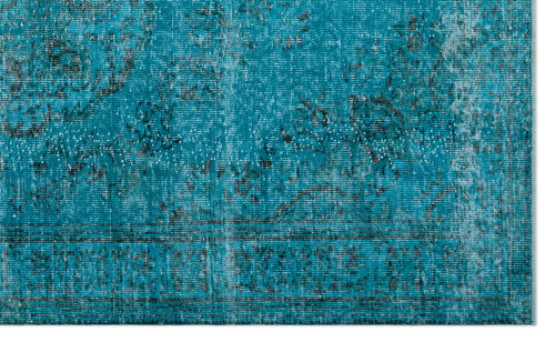 Load image 1 in gallery view. Teal and black distressed rug with a faded traditional floral medallion pattern.