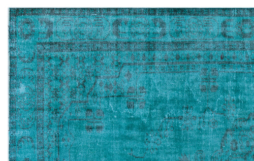 Load image 1 in gallery view. Teal and black distressed traditional rug with a faded ornate border and geometric medallion pattern.