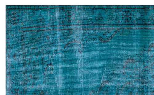 Load image 1 in gallery view. Teal and black distressed rug with a faded traditional floral border and medallion pattern.