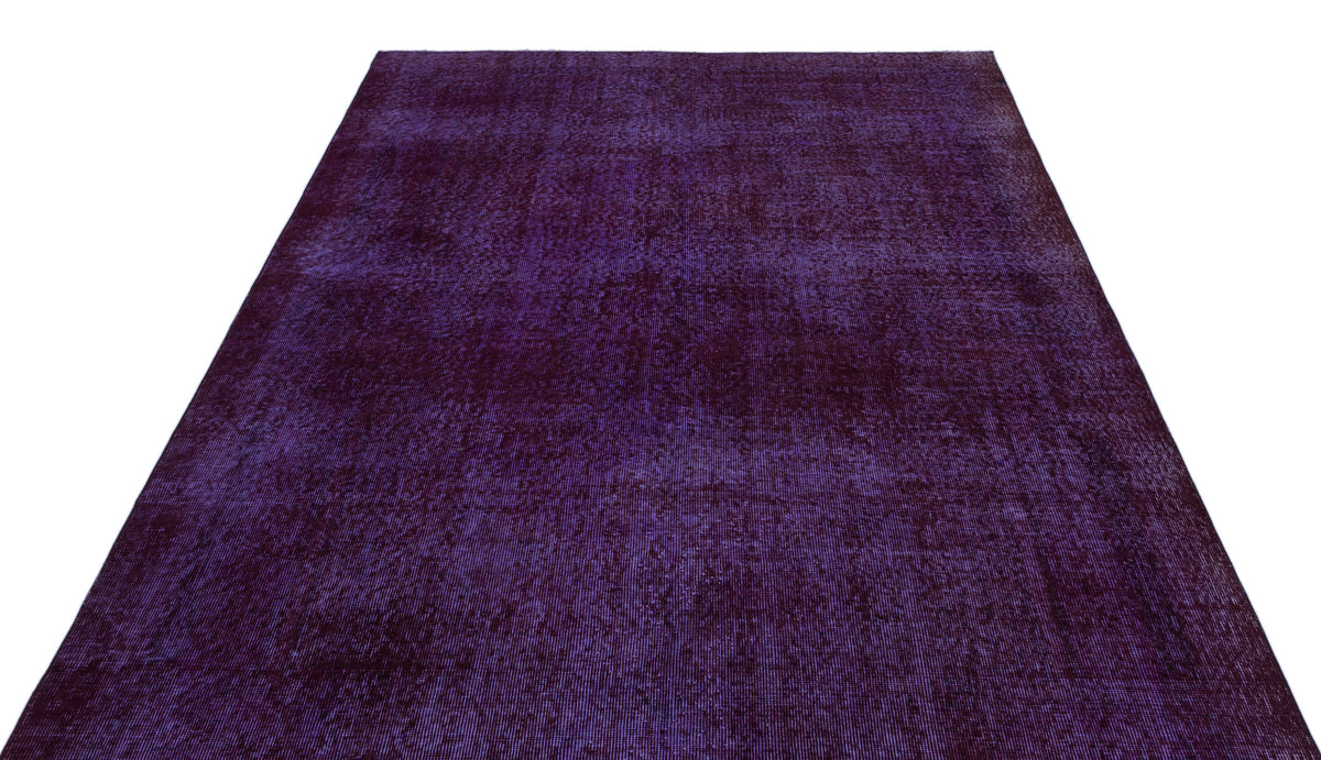 Deep purple vintage-style rug with a distressed, monochromatic texture on a white background.