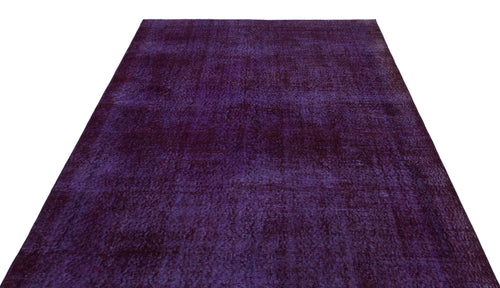 Load image 1 in gallery view. Deep purple vintage-style rug with a distressed, monochromatic texture on a white background.