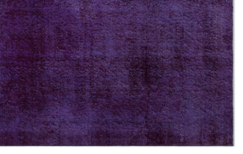 Load image 1 in gallery view. Deep purple solid-color rug with a subtle, distressed texture and horizontal weave pattern.