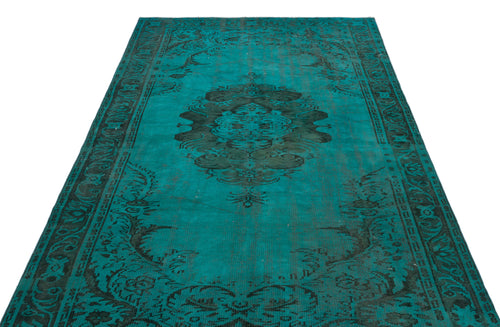 Load image 1 in gallery view. Teal and black distressed rug with a central medallion and ornate border pattern on a white background.