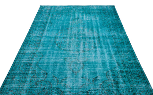Load image 1 in gallery view. Teal distressed vintage-style rug with a faded central medallion and ornate border pattern on a white background.
