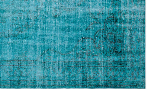 Load image 1 in gallery view. Teal and black distressed rug with a faded traditional medallion pattern.