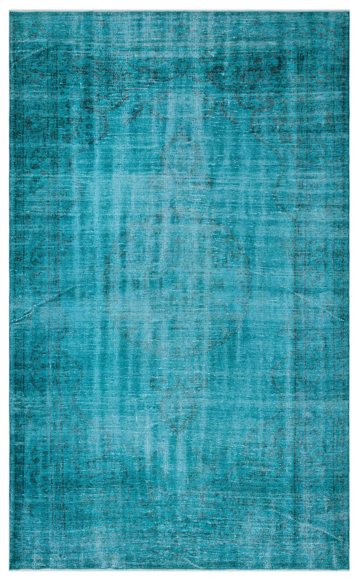 Teal distressed area rug with a faint, traditional medallion pattern and a worn, vintage-style texture.
