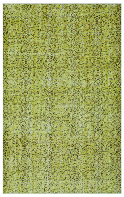 Load image 1 in gallery view. Chartreuse vintage-style rug with a distressed, repeating floral vine pattern in dark brown and muted red.