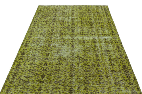 Load image 1 in gallery view. Chartreuse and dark brown distressed rug with an all-over traditional floral pattern.
