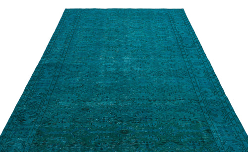 Load image 1 in gallery view. Teal distressed area rug with a traditional medallion and border pattern on a white background.