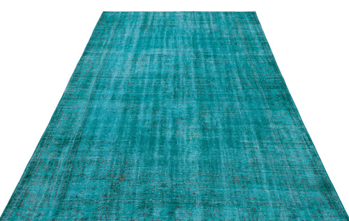 Load image 1 in gallery view. Teal distressed area rug with a faded traditional medallion pattern on a white background.