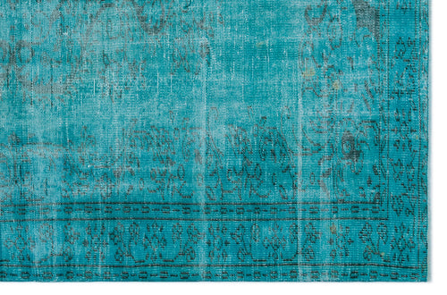 Load image 1 in gallery view. Teal distressed rug with a faded traditional floral medallion pattern and a dark border.