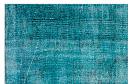 Load image 1 in gallery view. Teal distressed rug with a faded black traditional floral border and medallion pattern.