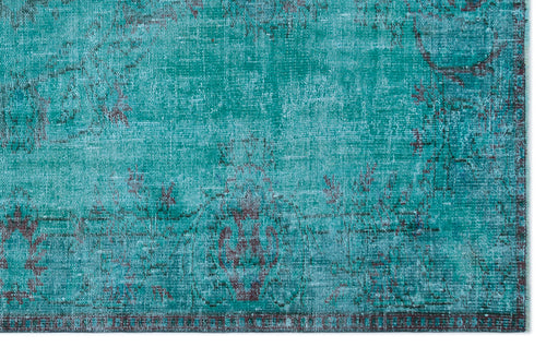 Load image 1 in gallery view. Teal and dark brown distressed rug with a faded traditional medallion pattern on a white background.