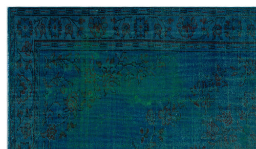 Load image 1 in gallery view. Deep teal and blue vintage-style rug with a dark floral border and distressed botanical pattern.