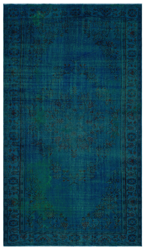 Load image 1 in gallery view. Deep blue vintage-style rug with a faded black floral medallion and intricate border pattern.