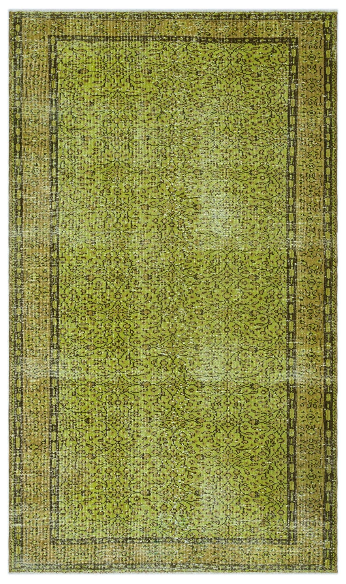 Chartreuse and olive green vintage-style rug with a distressed floral medallion pattern and a dark geometric border.