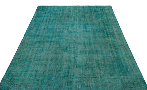 Load image 1 in gallery view. Teal distressed vintage-style rug with a faint, traditional medallion pattern on a white background.