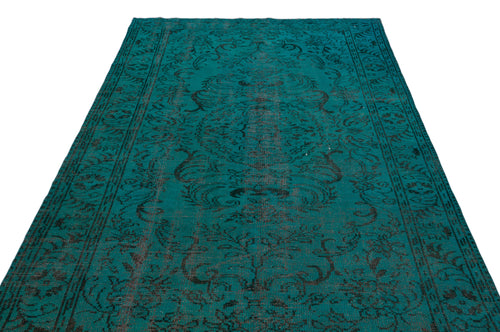 Load image 1 in gallery view. Teal and black distressed rug with a traditional floral medallion pattern.