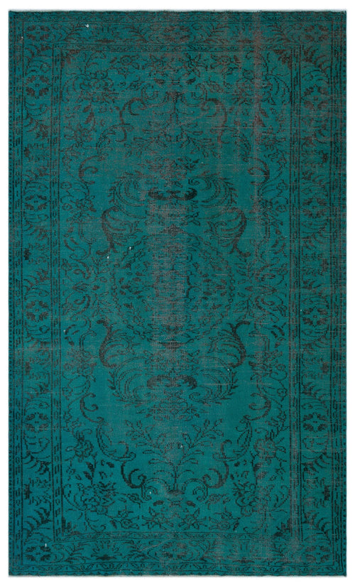 Load image 1 in gallery view. Teal and black distressed rug with a traditional floral medallion pattern and a decorative border.