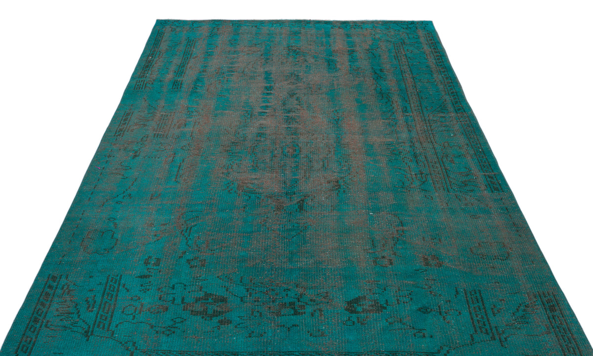 Teal and charcoal distressed vintage-style rug with a faded traditional medallion pattern on a white background.