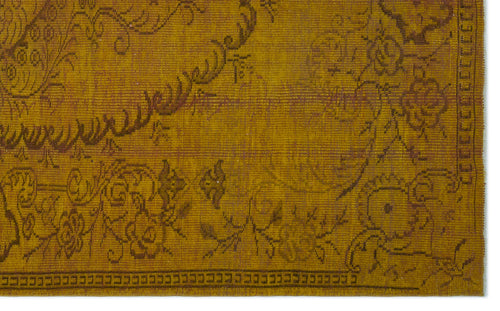 Load image 1 in gallery view. Mustard yellow vintage-style rug with a dark brown floral medallion pattern and a geometric border.