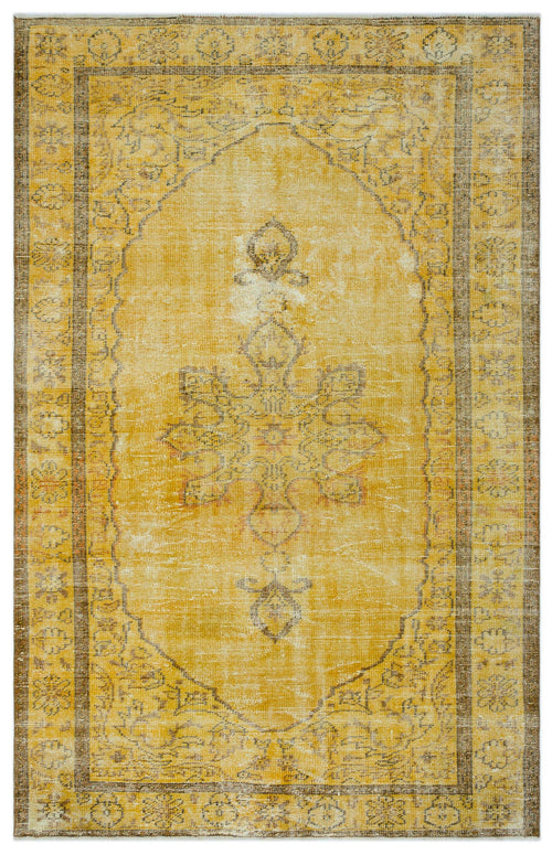 Load image 1 in gallery view. Mustard yellow and brown distressed rug with a central floral medallion and a decorative border.