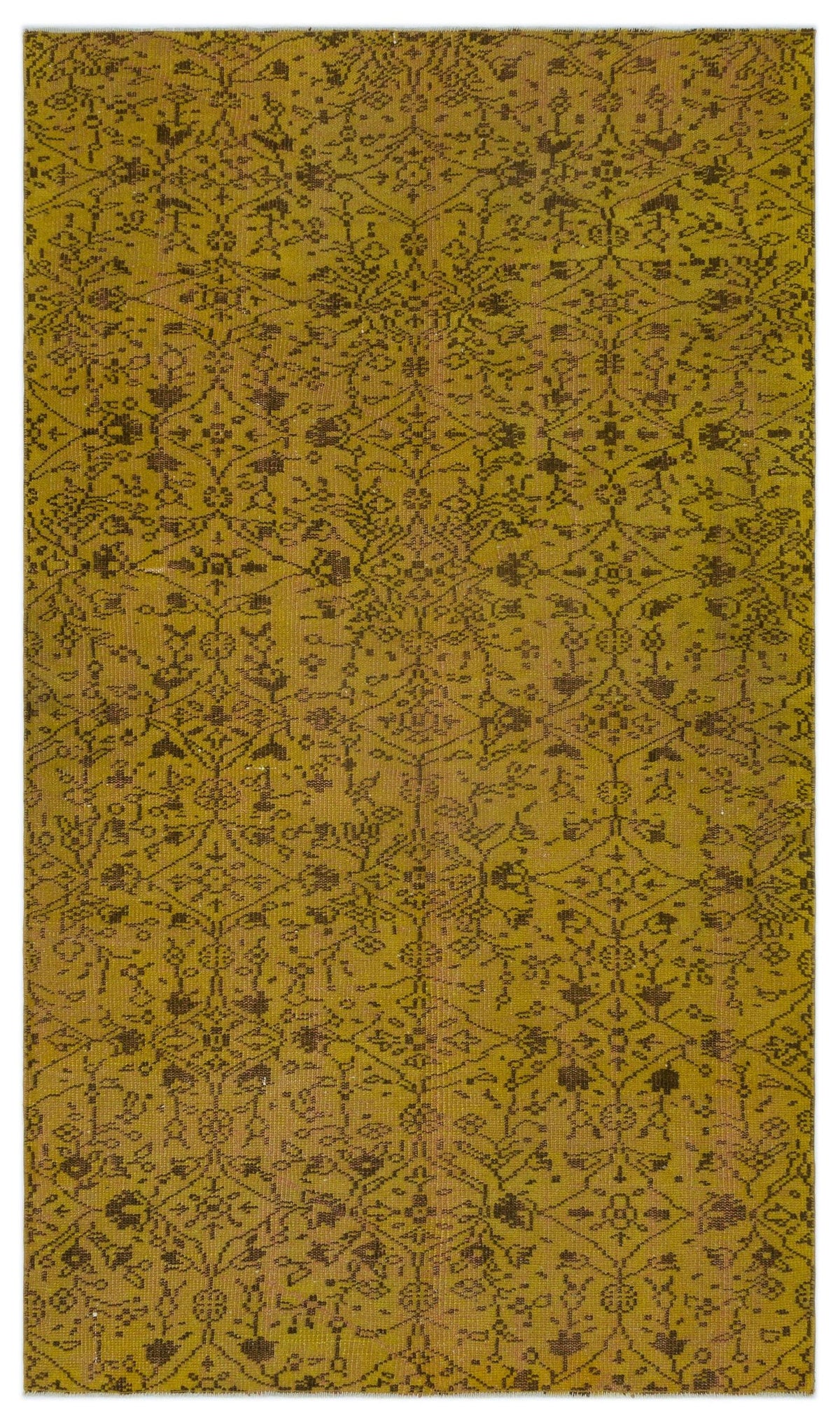 Mustard yellow rug with a dark brown distressed floral medallion pattern on a white background.