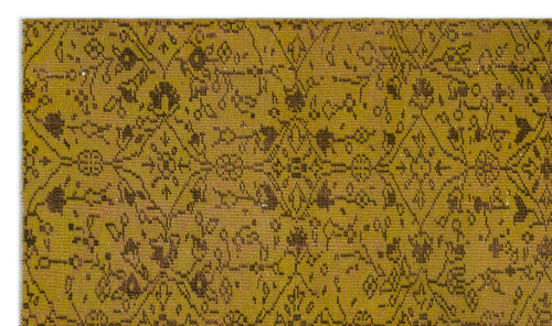 Load image 1 in gallery view. Mustard yellow rug with a distressed, dark brown traditional floral medallion pattern.