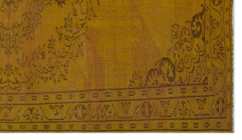 Load image 1 in gallery view. Mustard yellow vintage rug with a dark brown floral medallion and geometric border pattern.