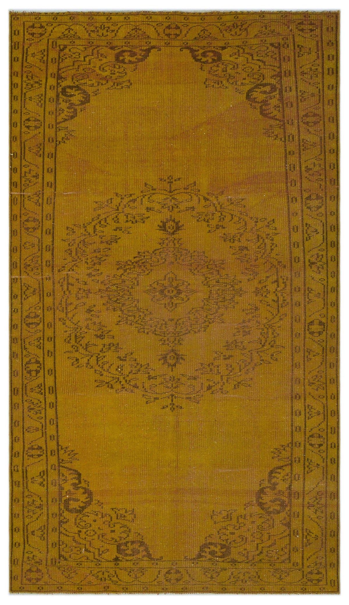 Mustard yellow vintage-style rug with a dark brown central floral medallion and a geometric border pattern.
