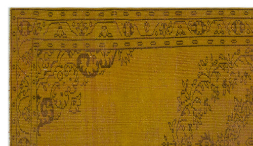 Load image 1 in gallery view. Mustard yellow rug with a dark brown traditional floral border and geometric corner motifs.