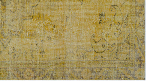 Load image 1 in gallery view. Mustard yellow and beige distressed rug with a faded traditional paisley and border pattern.
