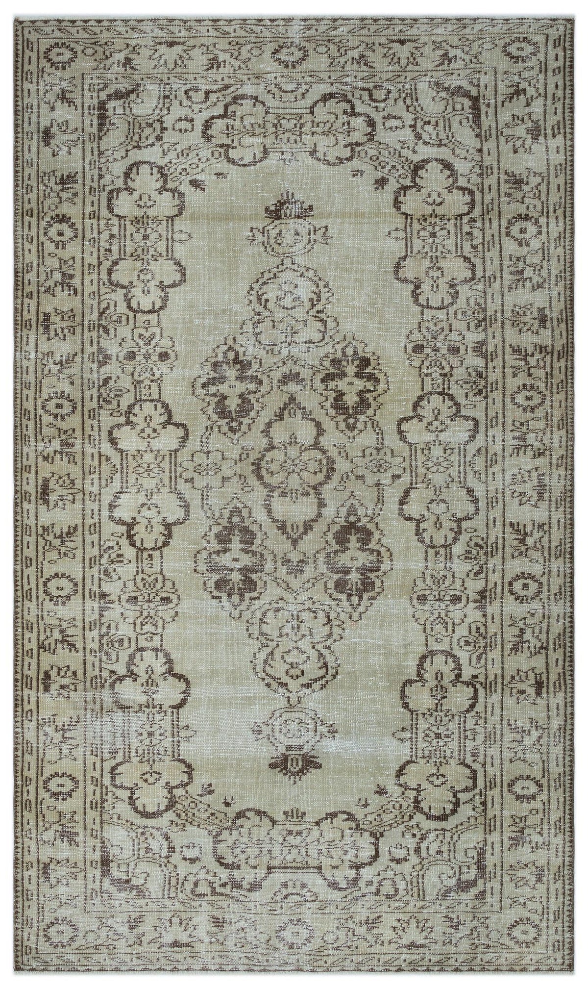 Beige and brown distressed rug with a traditional central medallion and ornate floral border.