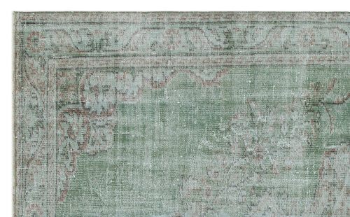 Load image 1 in gallery view. Sage green and terracotta distressed traditional rug with a faded floral medallion border.