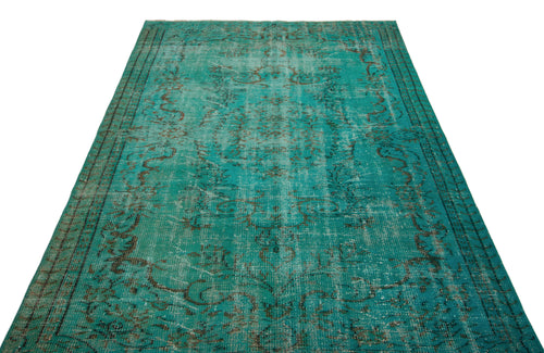 Load image 1 in gallery view. Teal distressed rug with a faded traditional floral medallion pattern and dark border on a white background.
