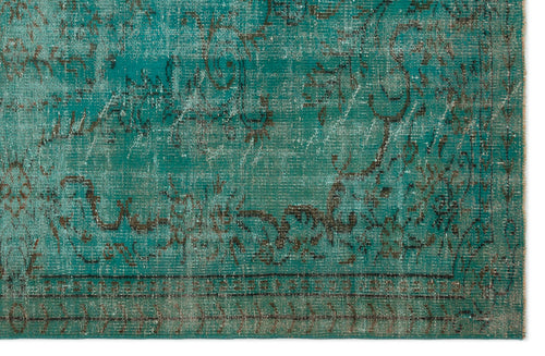 Load image 1 in gallery view. Teal and dark brown distressed rug with a faded traditional floral medallion pattern.