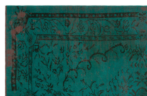 Load image 1 in gallery view. Teal and black distressed rug with a traditional ornate border and floral motif.