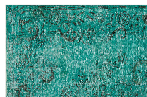 Load image 1 in gallery view. Teal and black distressed rug with a faded floral pattern and traditional border.