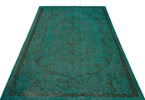 Load image 1 in gallery view. Teal and black distressed rug with a traditional central medallion and border pattern on a white background.