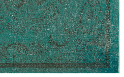 Load image 1 in gallery view. Teal and charcoal distressed rug with a traditional floral medallion pattern and a dark border.