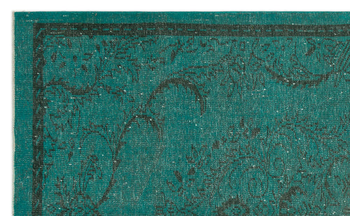 Load image 1 in gallery view. Teal rug with a distressed black floral pattern and a thin linear border.