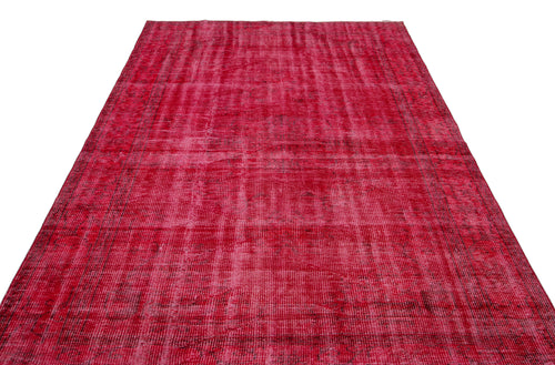 Load image 1 in gallery view. Distressed magenta and red vintage-style rug with a faded, overdyed geometric pattern on a white background.