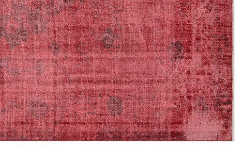 Load image 1 in gallery view. Red and pink distressed rug with a faded, vintage-style overdyed pattern.