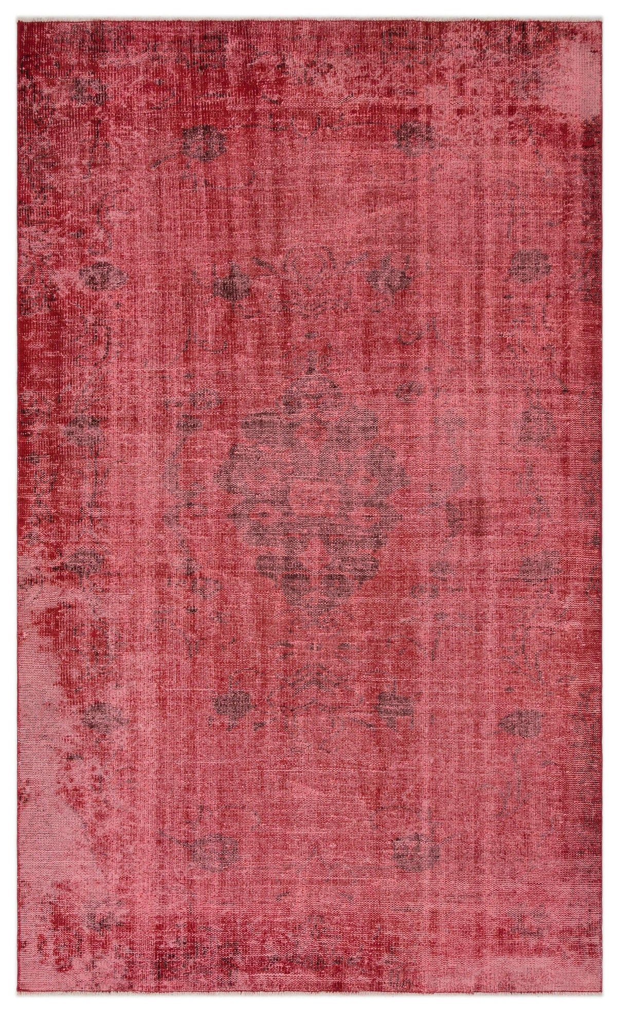 Distressed red rug with a faded central medallion and dark charcoal accents.