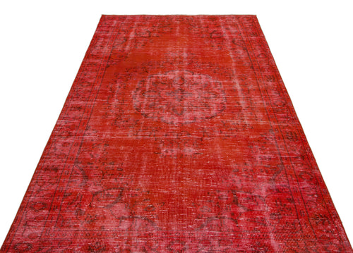 Load image 1 in gallery view. Distressed red vintage-style rug with a central medallion and ornate border pattern on a white background.
