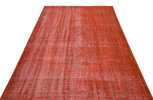 Load image 1 in gallery view. Distressed red vintage-style rug with a faded, overdyed texture and subtle border pattern on a white background.