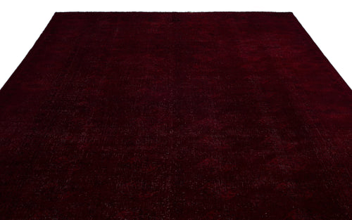 Load image 1 in gallery view. Solid deep burgundy rug with a subtle, distressed tonal texture on a white background.